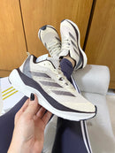 ADIZERO MARROM