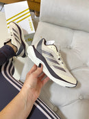 ADIZERO MARROM